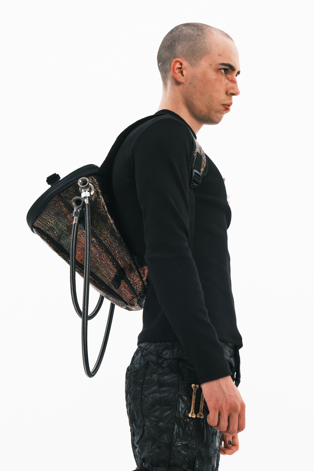 EMBRYO ORACLE embossed backpack — alternate modeled angle