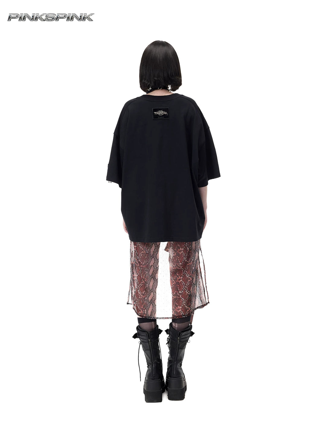 PINKSPINK PLANT PUNK oversized graphic tee in black — full-length rear modeled view showing the small upper-back logo patch
