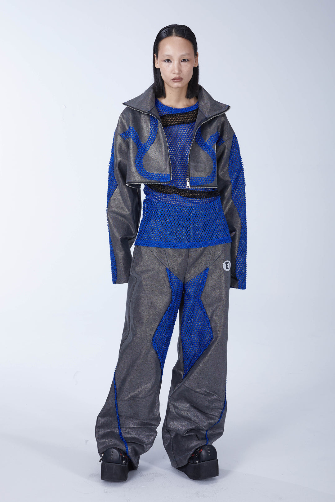 EMBRYO REVERSE CORE metallic canvas wide-leg pants — construction and silhouette detail