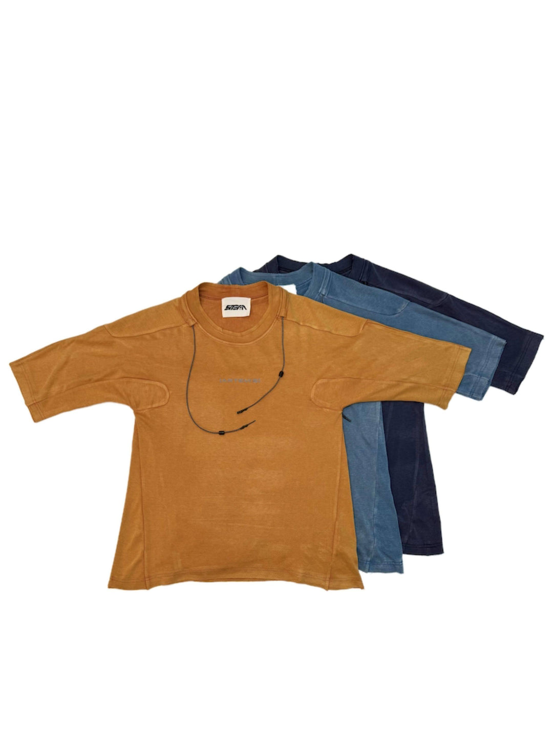 LIGHTSHADOW mycelium blue deconstructed technical tee — family color comparison with orange, blue and purple tees layered flat on a white background