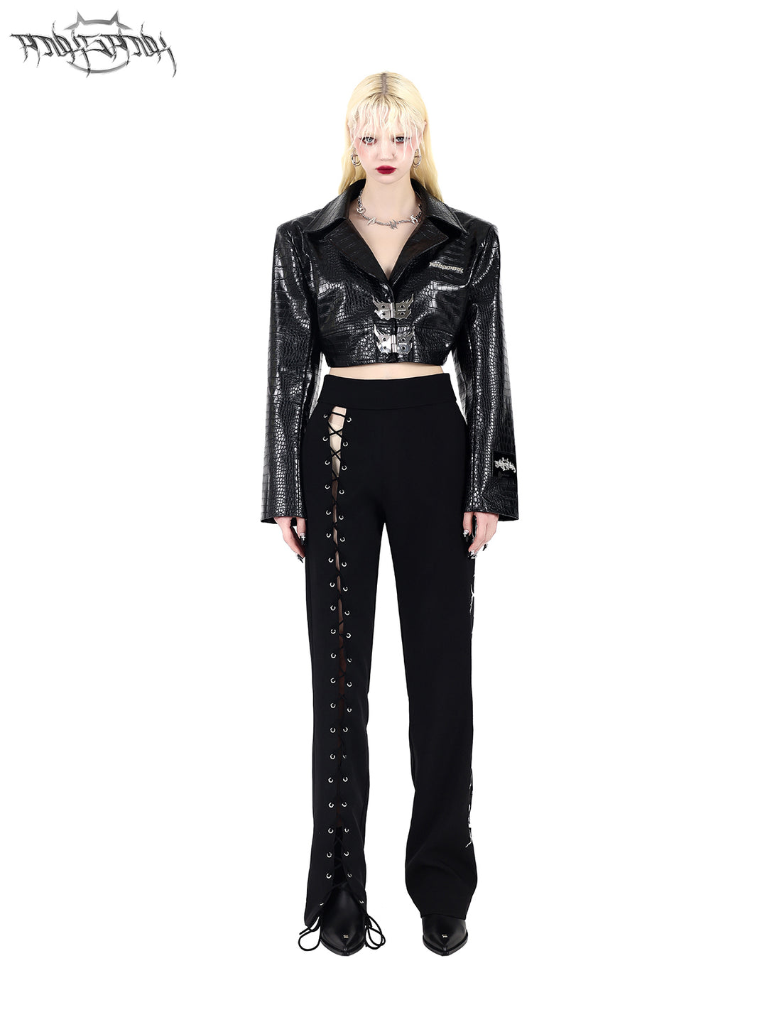 PINKSPINK FLAME BUCKLE — Black jacket, full front view styled with trousers.