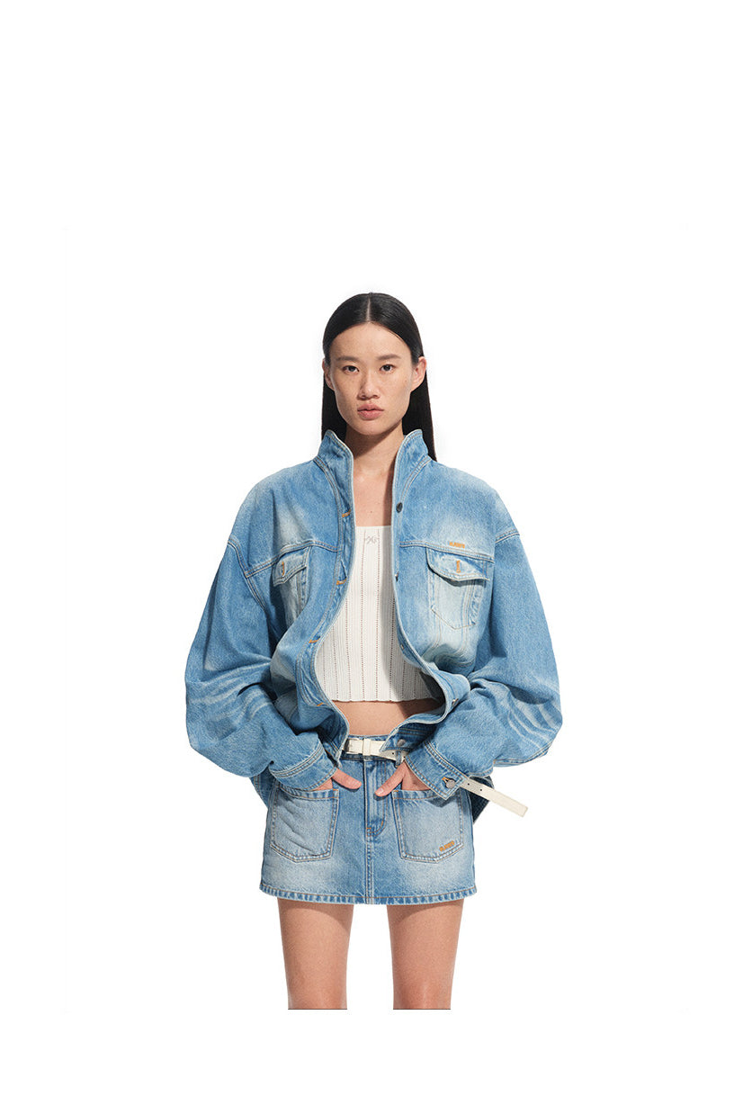 NAWS VOLCANO washed denim stand-collar jacket — product detail view showing texture and hardware
