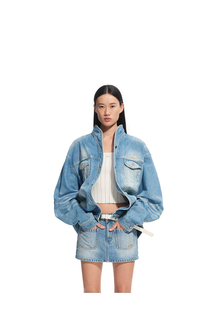 NAWS VOLCANO washed denim stand-collar jacket — product detail view showing texture and hardware