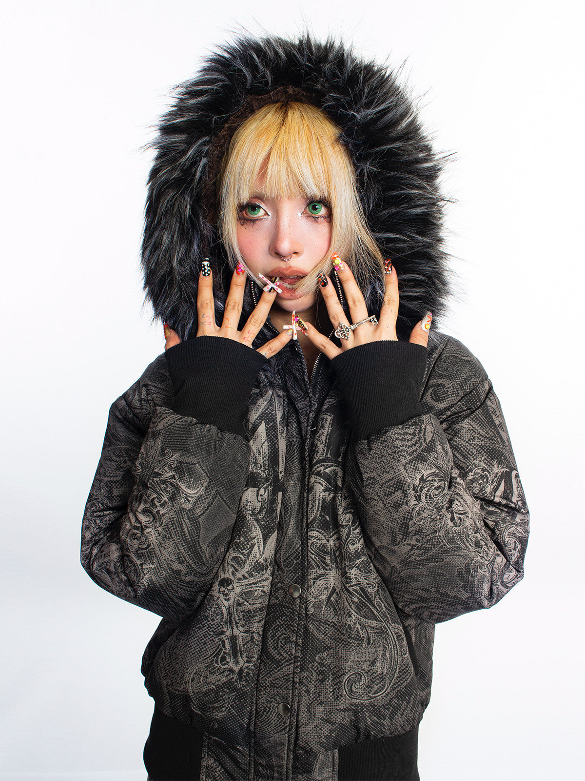 4RE1GN GOTHIC down jacket in charcoal ornamental print — Hood-up close-up showing plush trim and patterned sleeves.