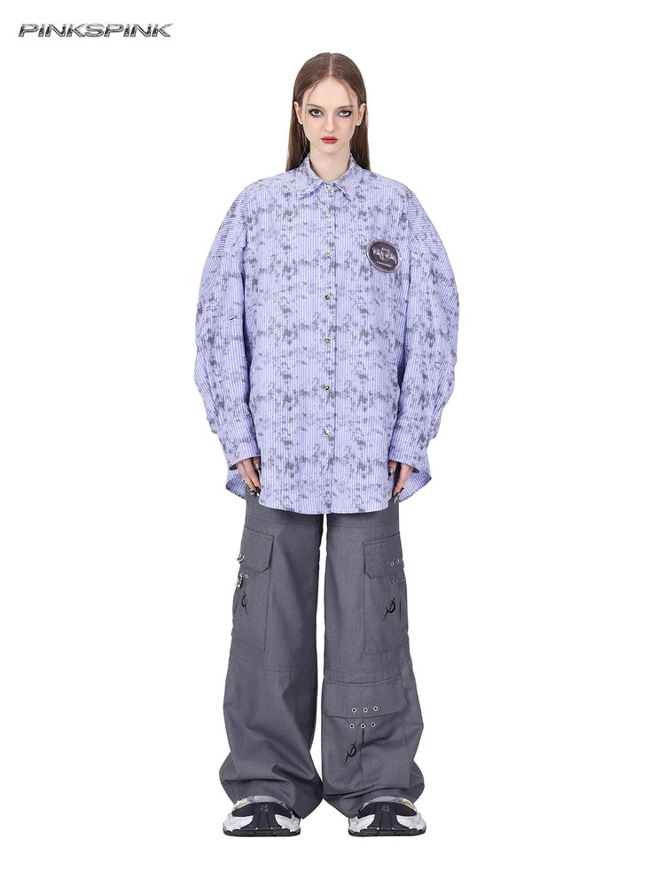PINKSPINK ELECTRIC MOON ring-detail cargo flare trousers in gray — full-length front view styled with a separate striped shirt