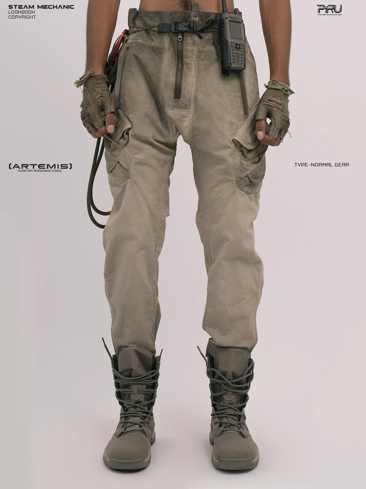 AEGIS lunar soil teal multi-pocket moto pants — front modeled view showing the angled cargo pockets