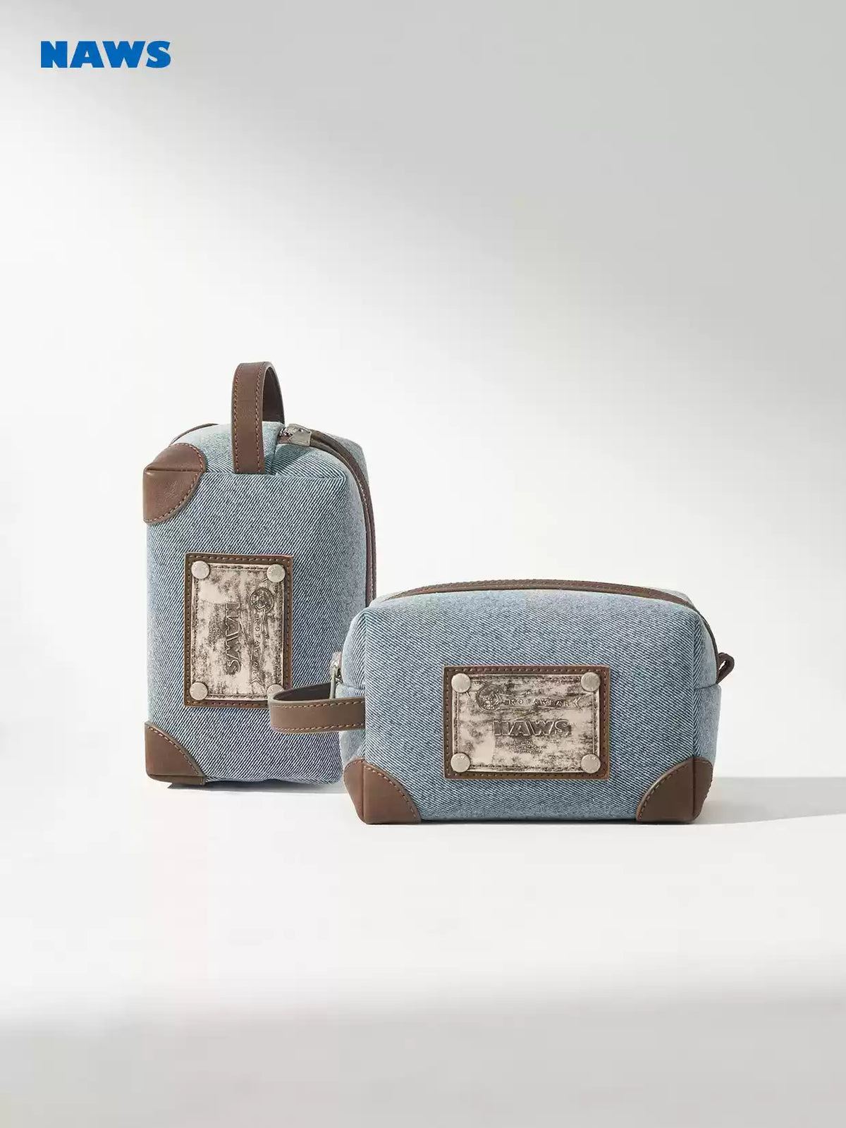 NAWS BLUE BOX denim makeup bag — close modeled view highlighting the construction