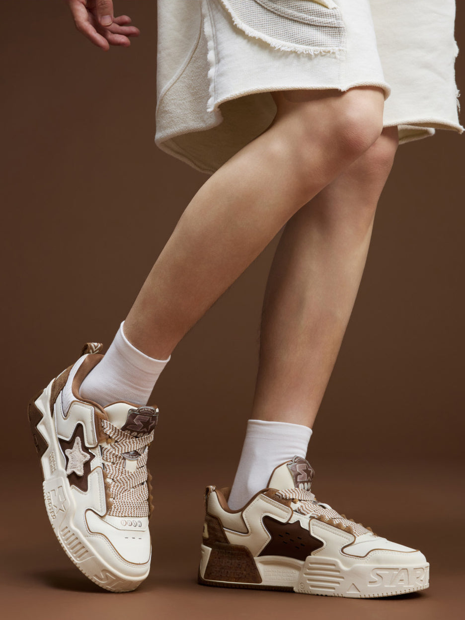 STARTER VOL 90S LATTE front and outer-side on-foot views showing broad patterned laces and padded tongues