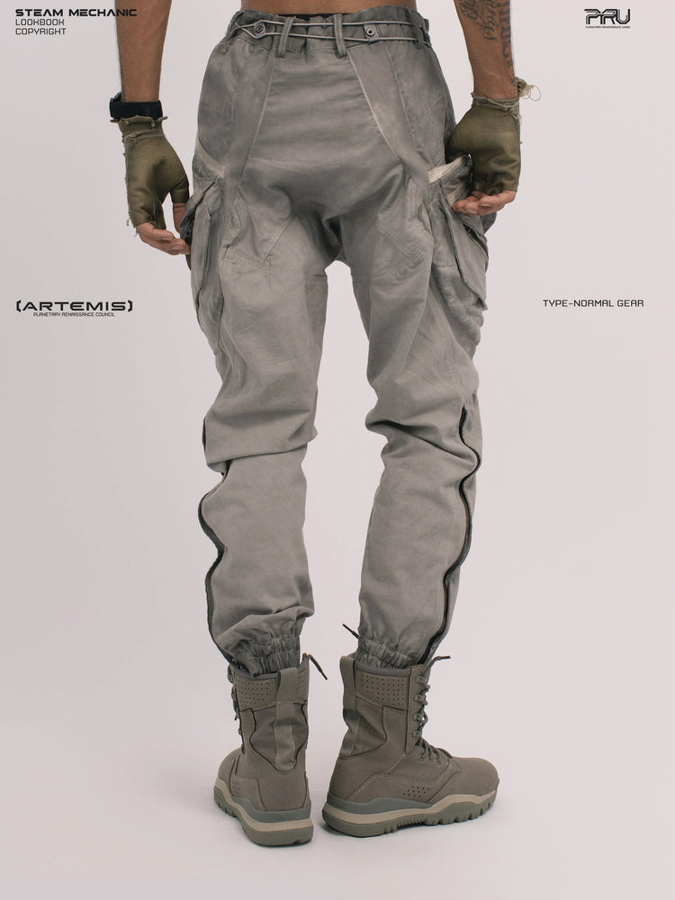 AEGIS lunar sea gray multi-pocket moto pants — alternate rear modeled view with hands resting at the cargo pockets