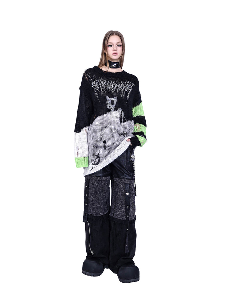 PINKSPINK SPHYNX distressed striped graphic sweater — black-green graphic sweater — front view with hem lifted at one side