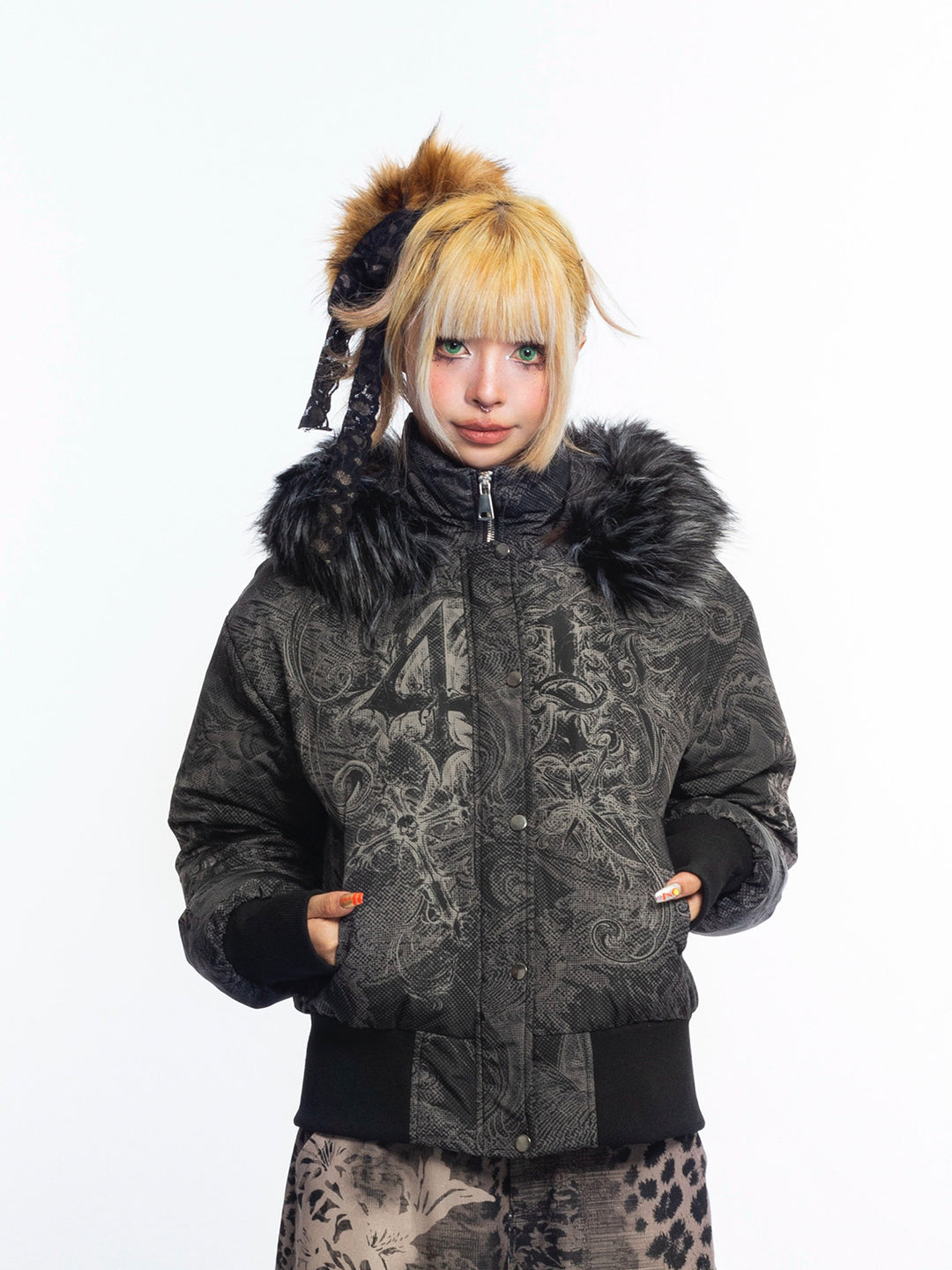 4RE1GN GOTHIC down jacket in charcoal ornamental print — Front modeled view with hands in pockets and hood down.