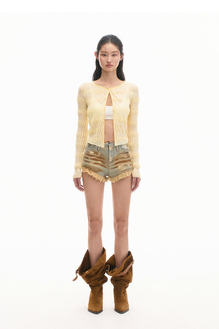 NAWS PYTHON distressed denim shorts — close-up view of the material and finishing