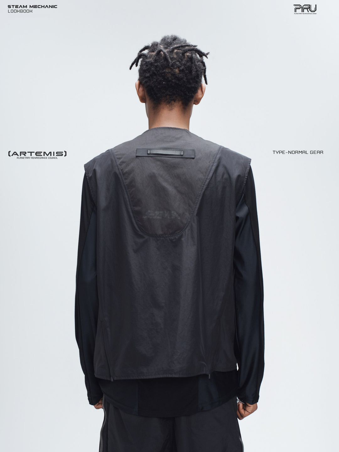 CLERIC utility nylon vest in stardust black — back modeled view showing the curved panel and webbing loop