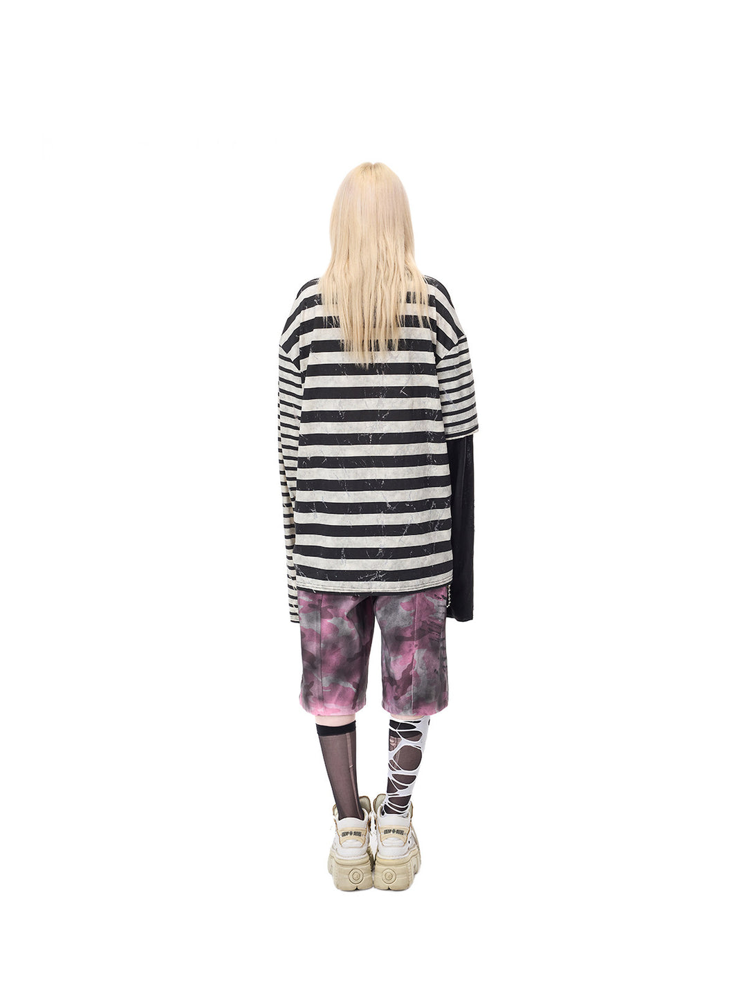 PINKSPINK STATIC asymmetric striped burnout long-sleeve tee in black and white — full-length rear modeled view over separate pink camouflage shorts