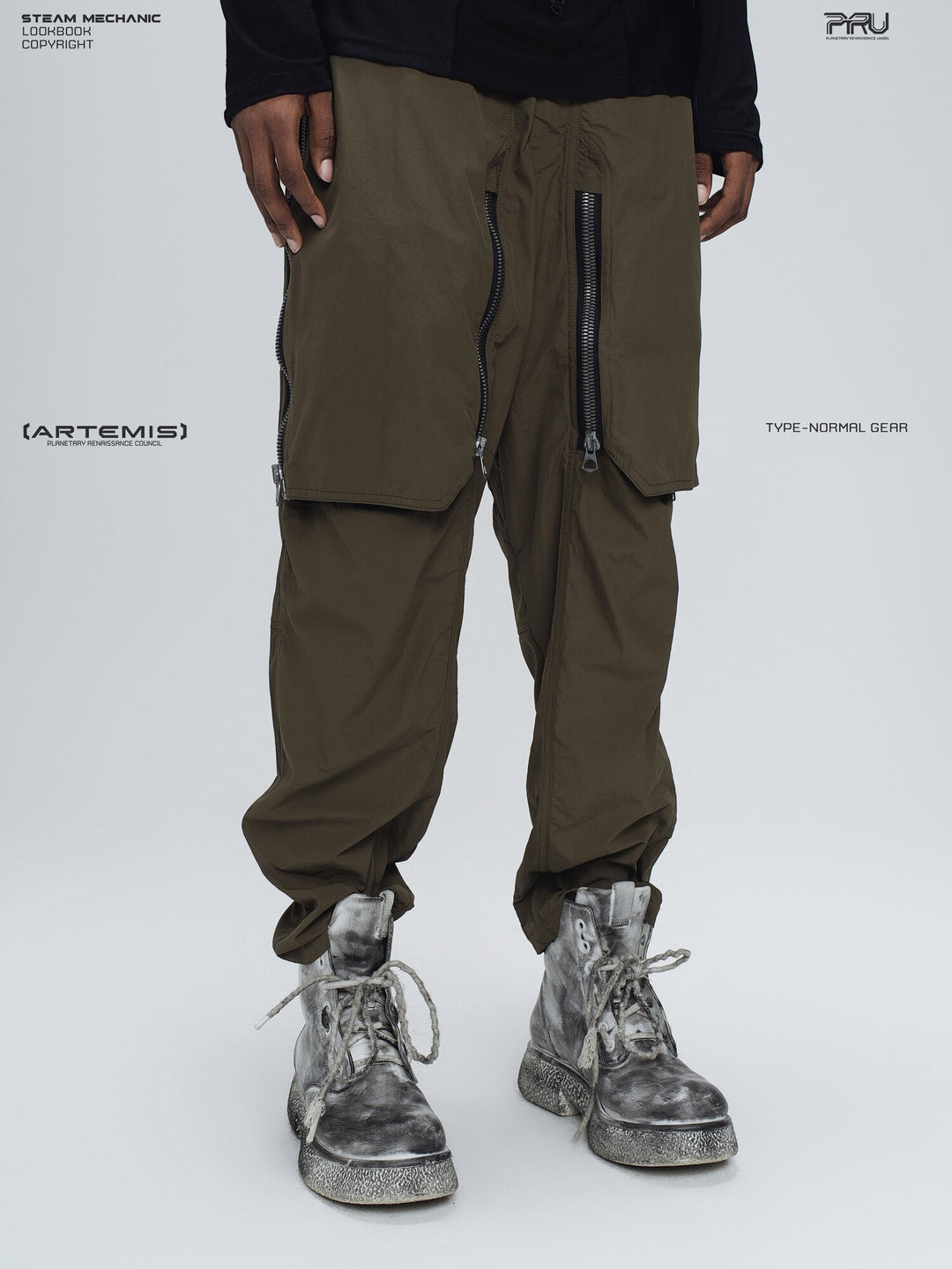 GAIA curved-blade technical pants in mountain green — three-quarter modeled view with the front pocket covers closed