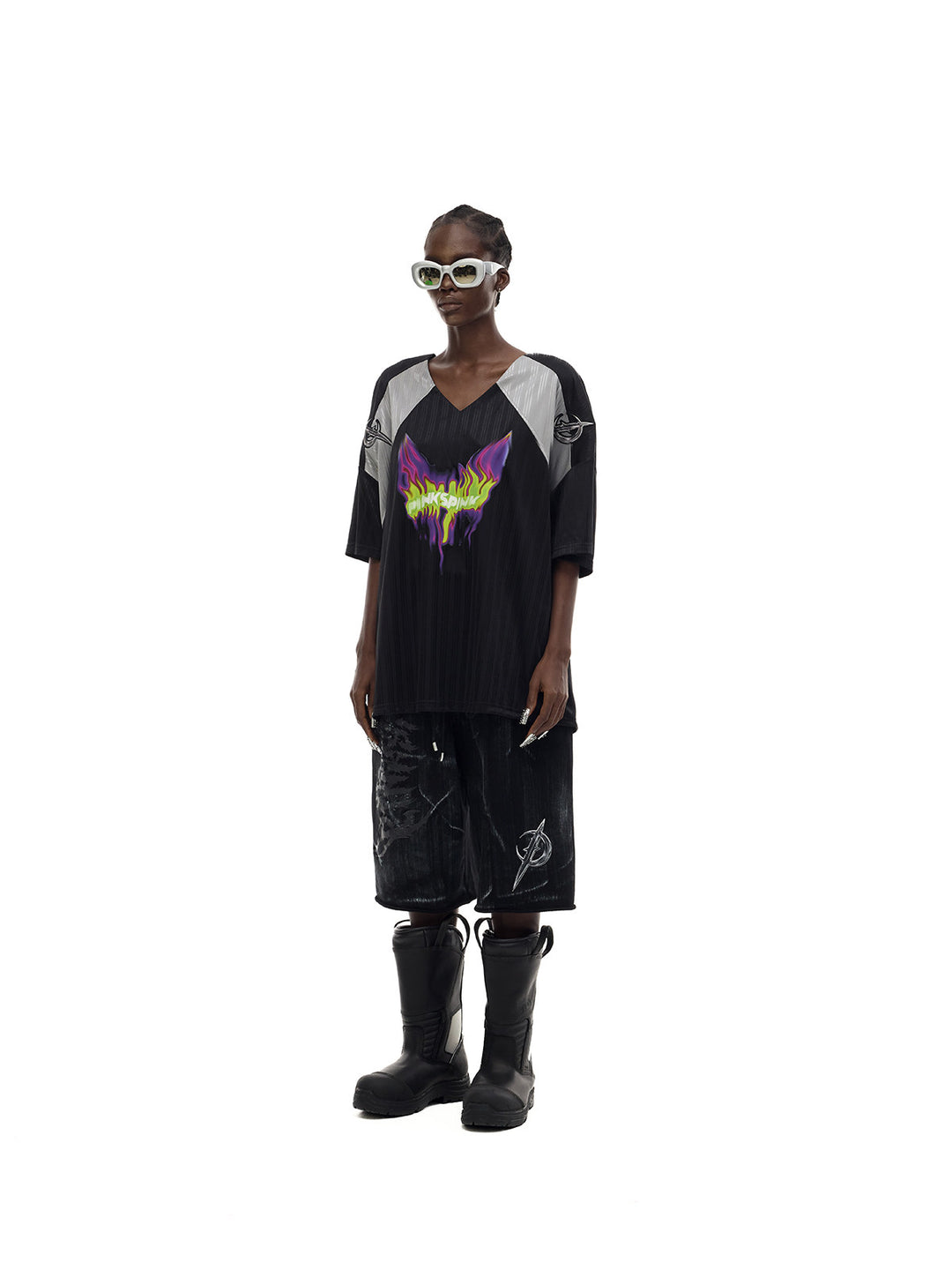 PINKSPINK FLAMECAT oversized sports jersey in black and gray — angled full-length loose view styled with separate shorts