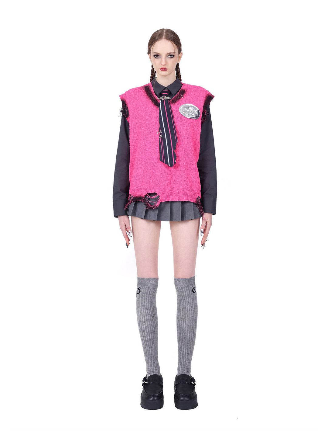 PINKSPINK REBEL distressed ring-detail knit vest in pink — straight-on full-length front modeled view layered with a separate dark shirt and tie