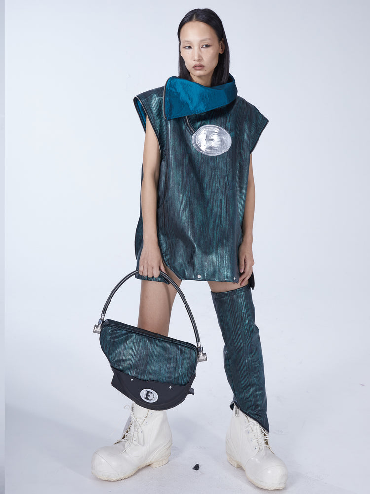 EMBRYO TIRELINE embossed underarm bag — full-length modeled view