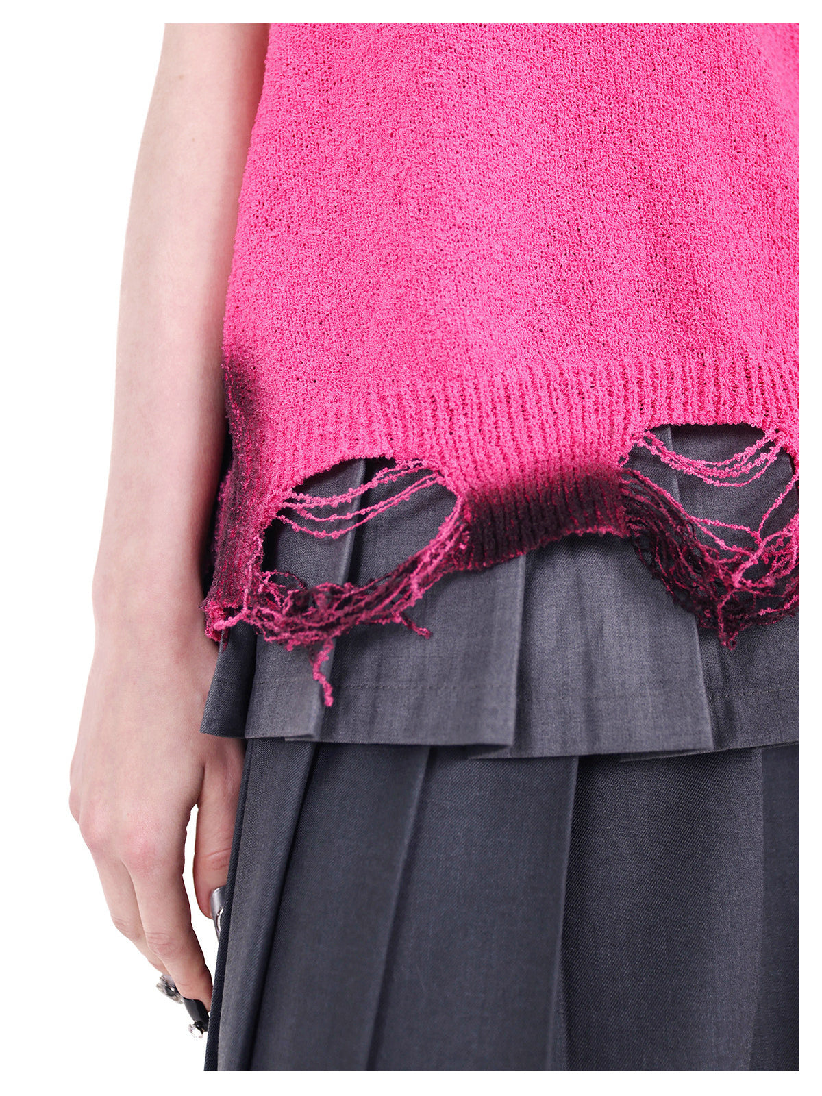 PINKSPINK REBEL distressed ring-detail knit vest in pink — close-up of the unraveling hem openings and dark sprayed knit edges