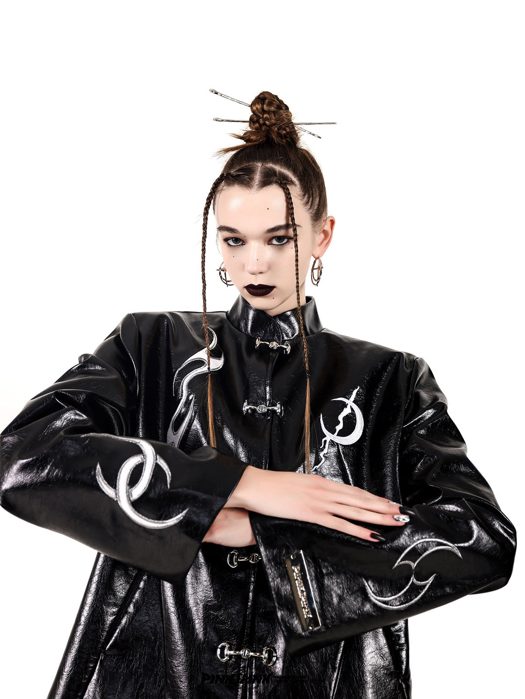 PINKSPINK ELECTRIC MOON embroidered buckle jacket — black folded-arm close-up showing the embroidered sleeves