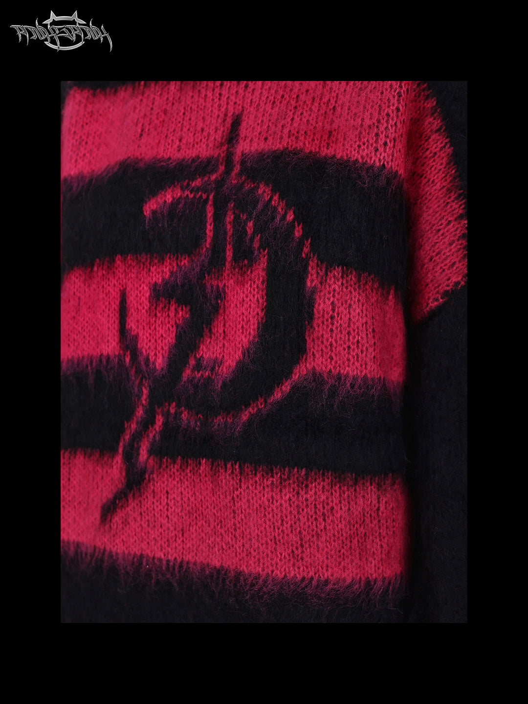 PINKSPINK ELECTRIC MOON black-pink striped sweater in black pink — close-up of the electric-moon motif and fuzzy knit texture