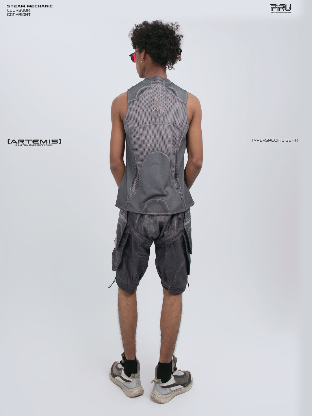 AEGIS stellar blue distressed mesh tank top — full-length rear modeled view with the head turned left