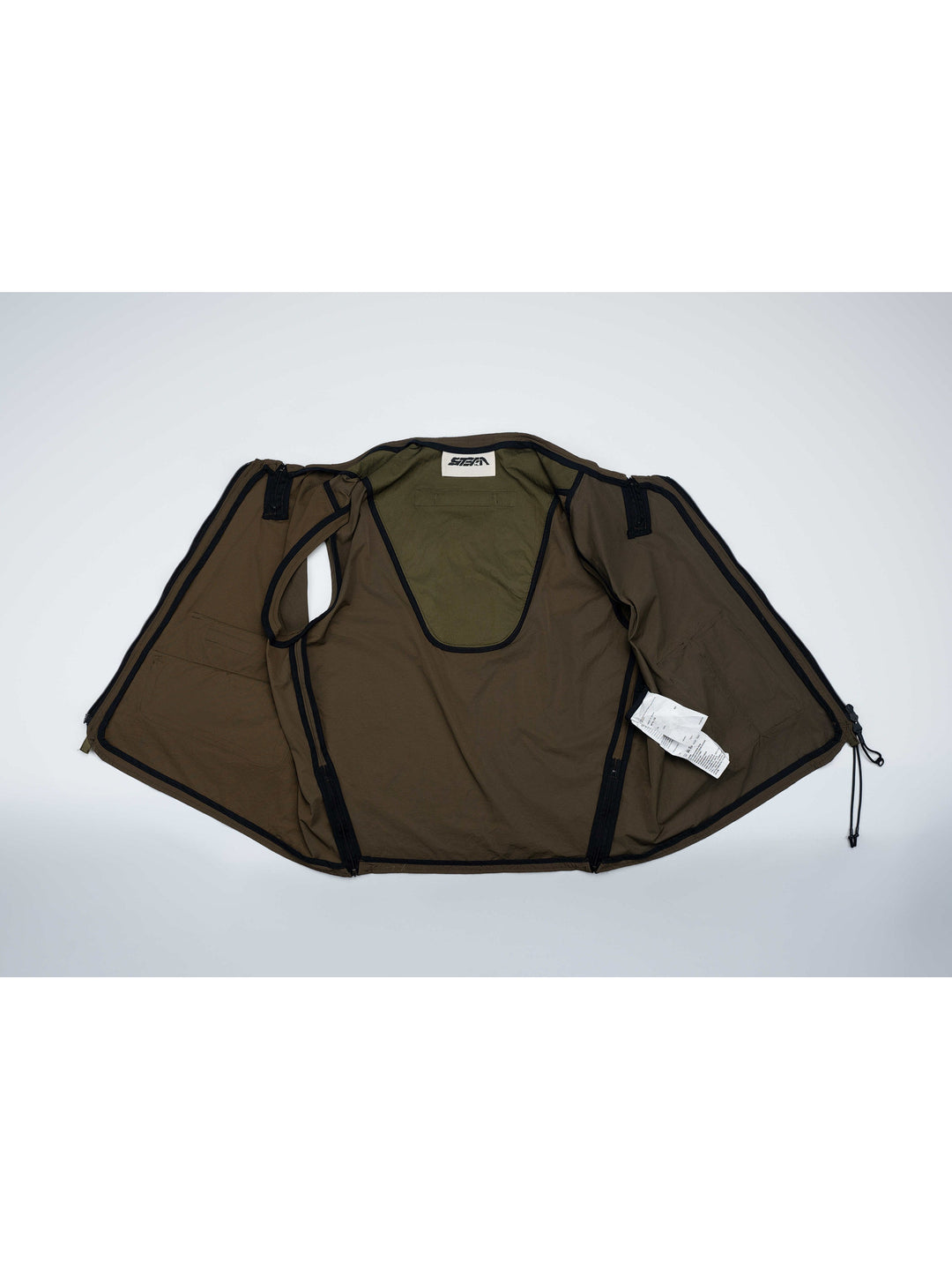 CLERIC utility nylon vest in vine gray green — open flat-lay showing the inside construction and bound seams