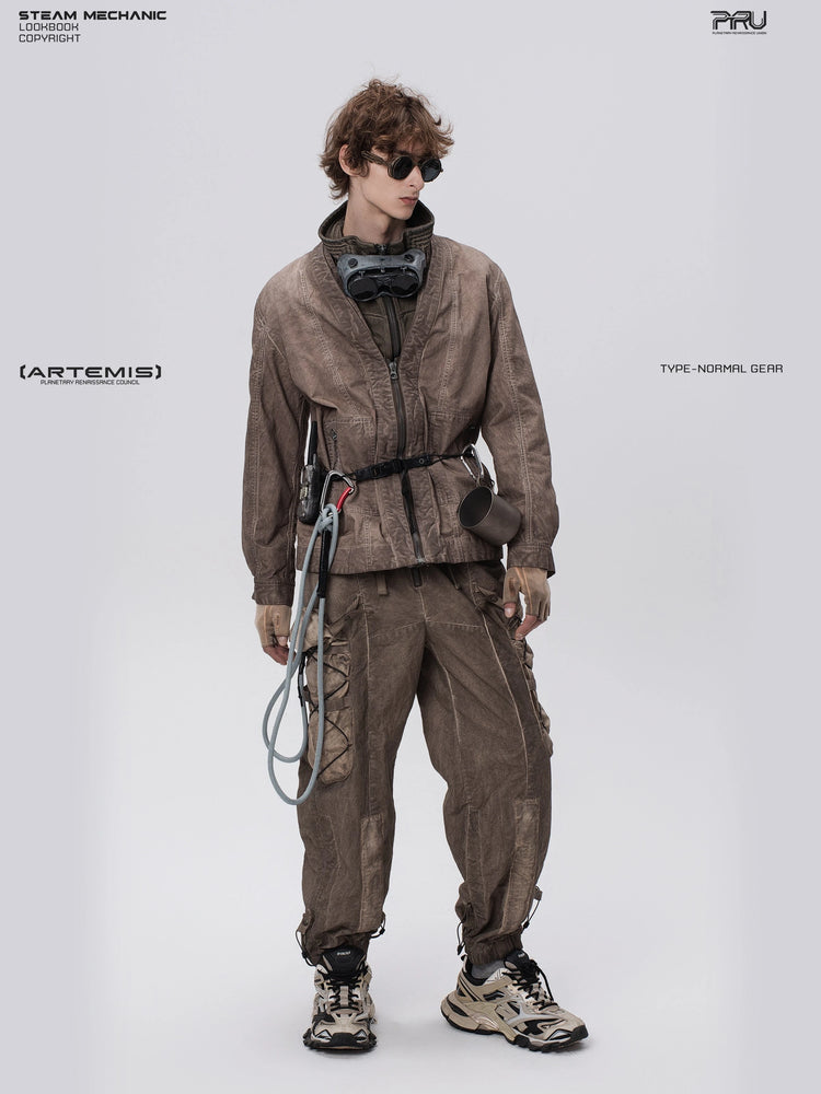 GAIA ochre brown open-collar technical robe — full-length modeled view in an angled stance
