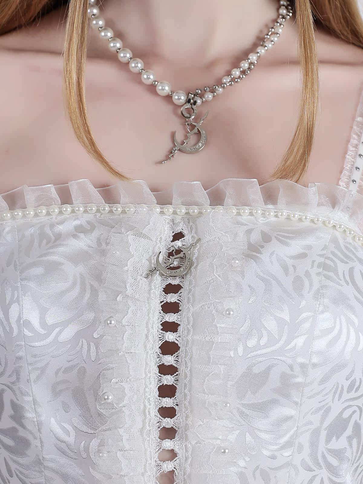 PINKSPINK FAIRY pearl-trim asymmetric mini dress — modeled bodice close-up showing pearl-effect beads and the moon charm
