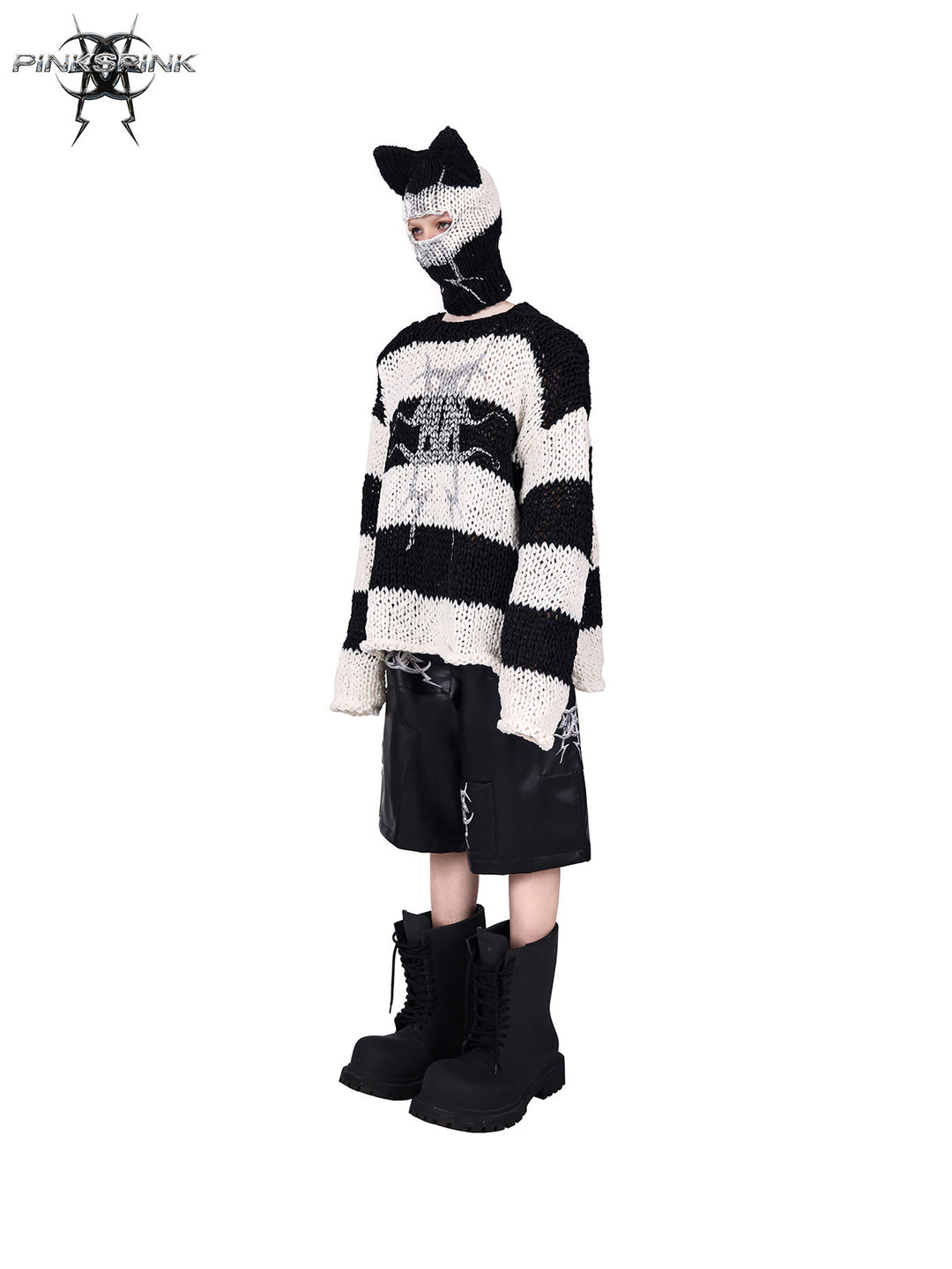 PINKSPINK MIRROR striped open-knit padded-shoulder sweater in black white stripes — side full-length modeled view with the matching balaclava