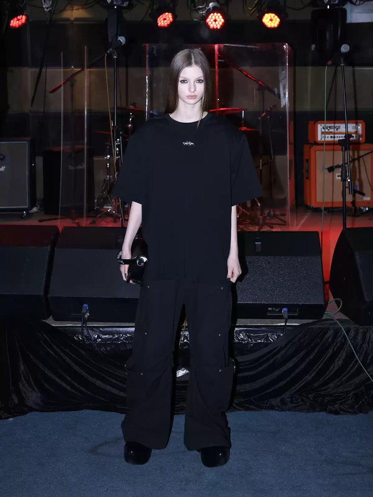 PINKSPINK METAL LOGO padded-shoulder oversized tee — modeled front styling view