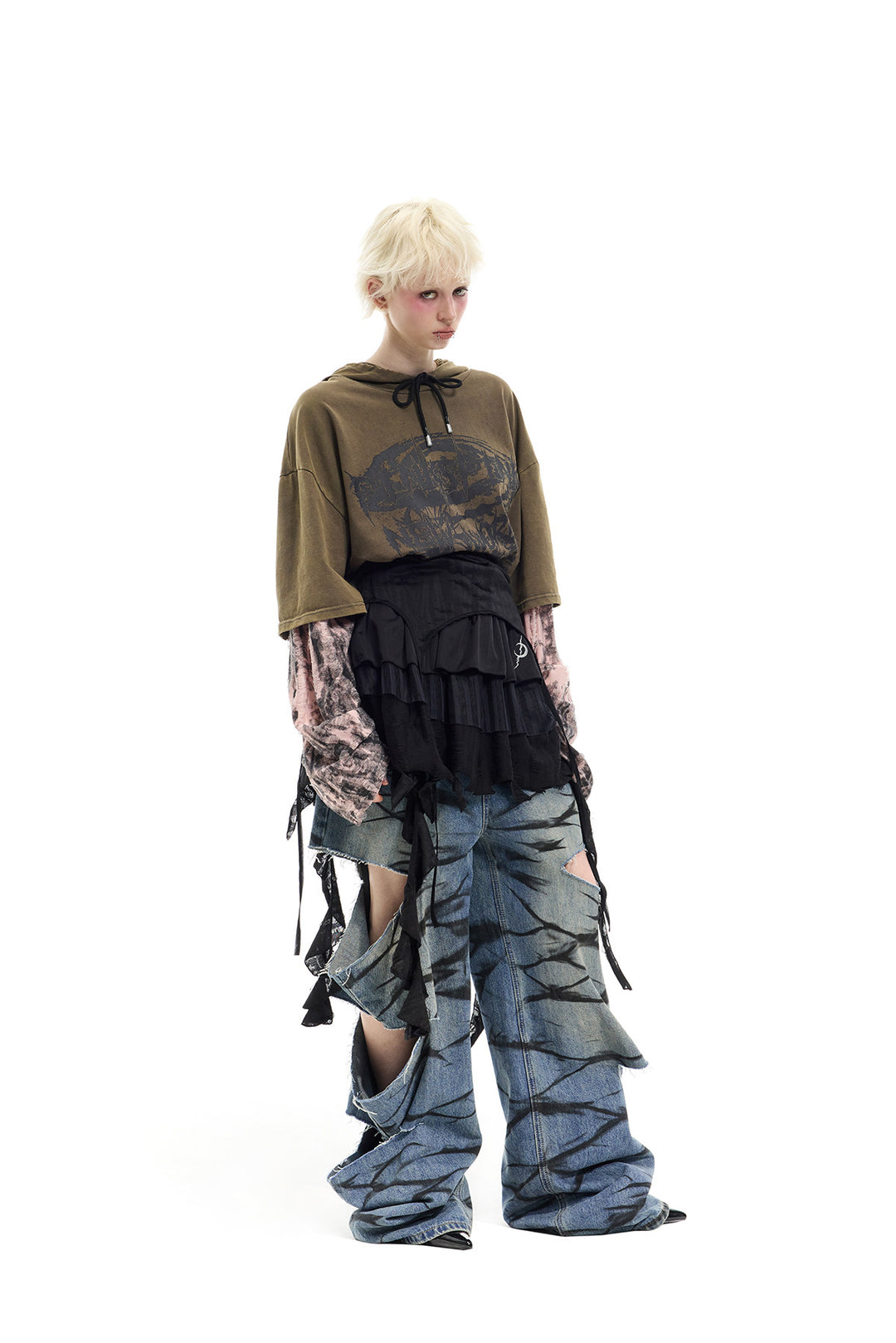 PINKSPINK ELECTRIC MOON two-way layered lace mini dress — black dress worn as a skirt over jeans — angled full-length view