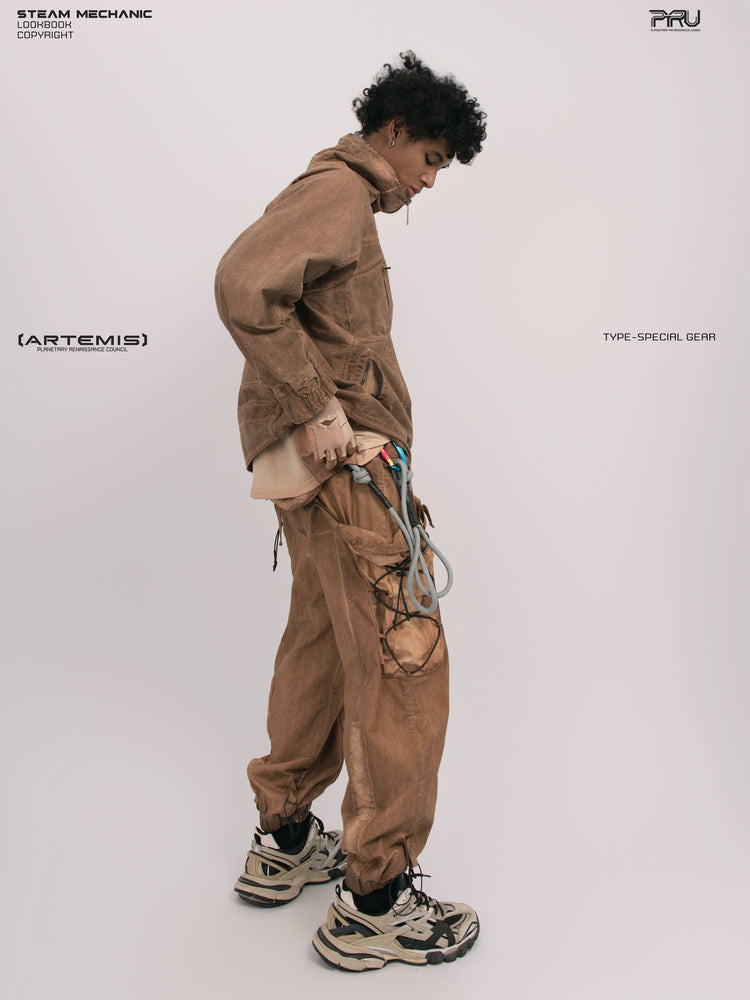 ARTEMIS soft dawn orange tuck-paneled technical jacket — full-length side modeled view with raised collar