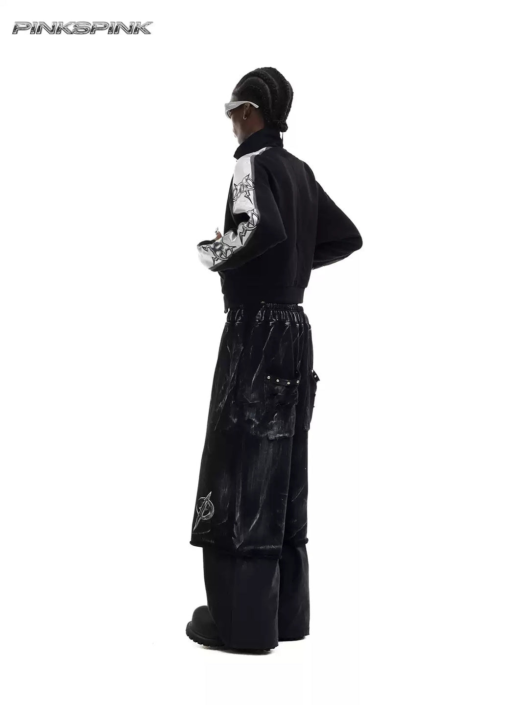 PINKSPINK ELECTRIC MOON coated cropped wide-leg pants in black — rear three-quarter modeled view showing studded patch pockets