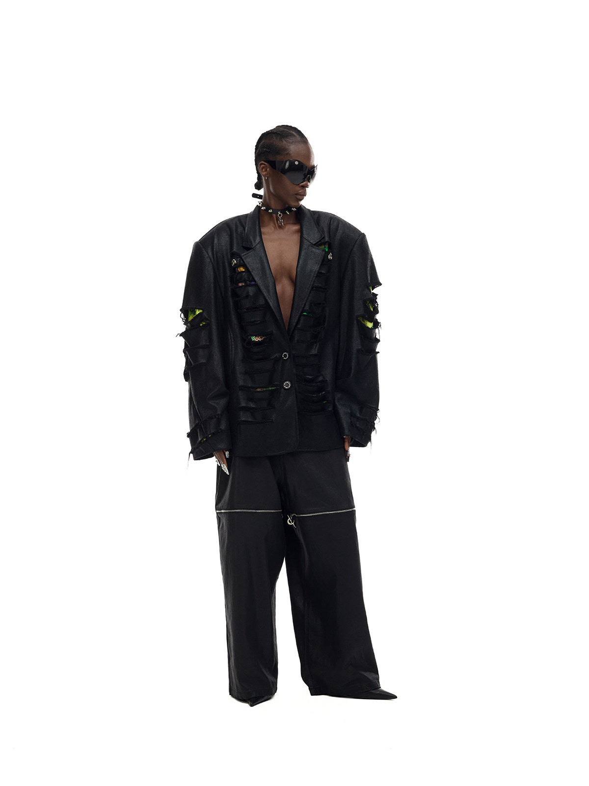 PINKSPINK ELECTRIC MOON coated zip-knee wide-leg pants in black — three-quarter front modeled view styled with a blazer