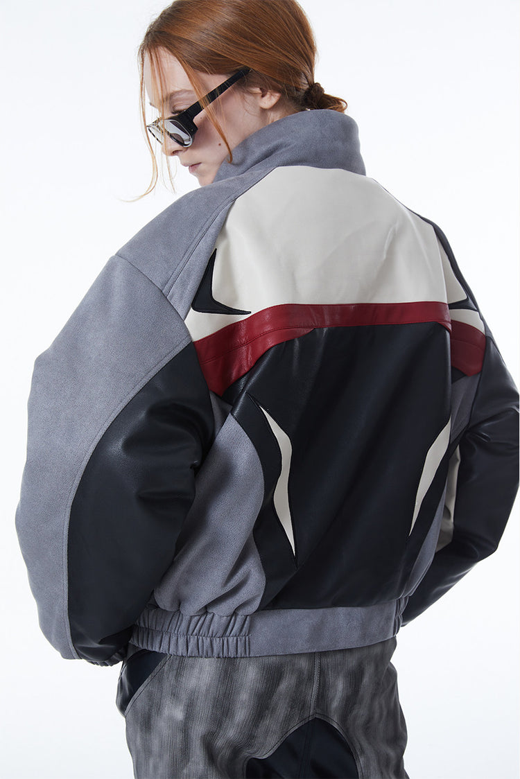 ERRORCODE ROBOT haze-blue contrast-panel padded racing jacket, rear three-quarter close-up showing black, ivory and red racing panels