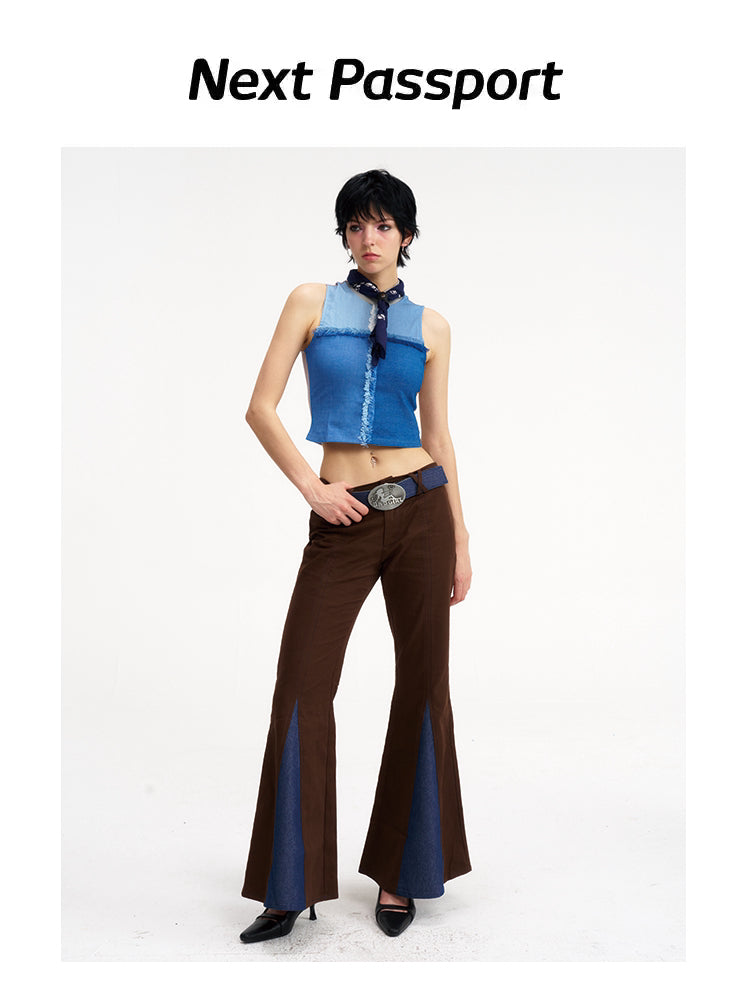NEXT PASSPORT denim-panel low-rise flared pants in brown — front angled with hand at the waist modeled view.