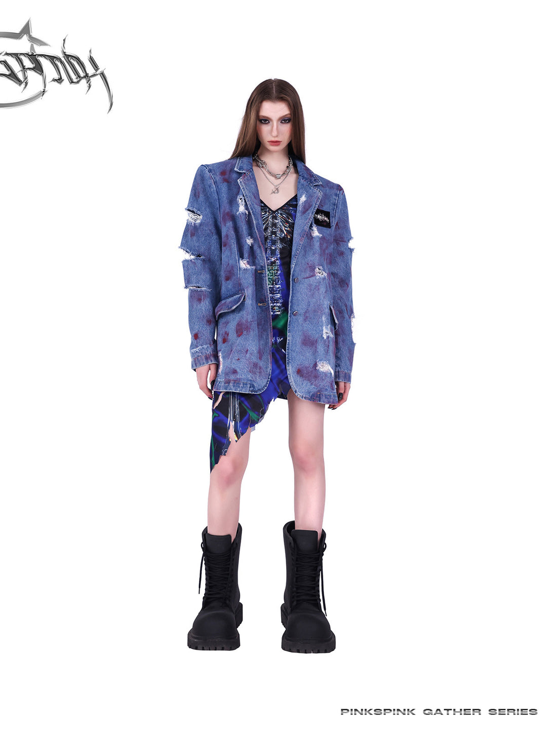 PINKSPINK COSMOS skeleton-print asymmetric slip dress in blue green multicolor — front modeled view layered under a blue jacket