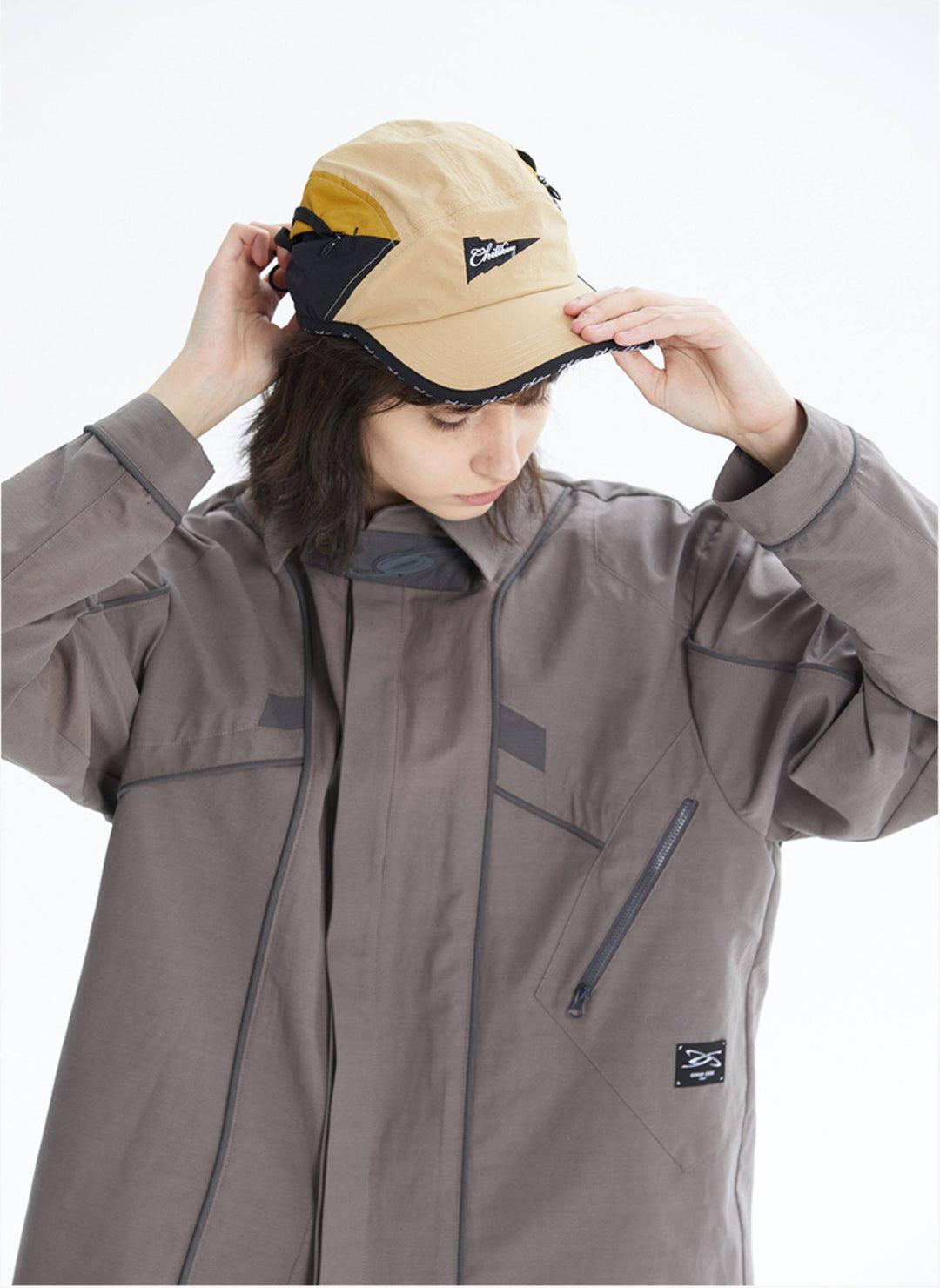 ERRORCODE ROBOT taupe tech work shirt — front modeled view adjusting cap