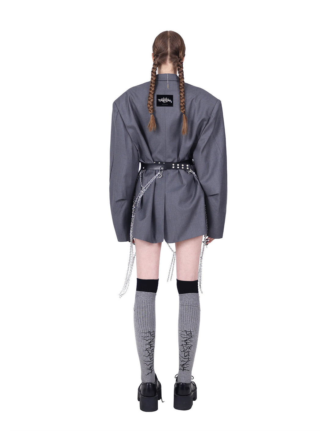 PINKSPINK REBEL pierced oversized tailored blazer in gray — rear modeled view with a separate belt cinching the waist