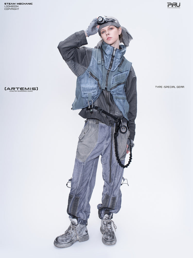 FISSION modular vest — star blue full-length modeled view with raised hand at goggles