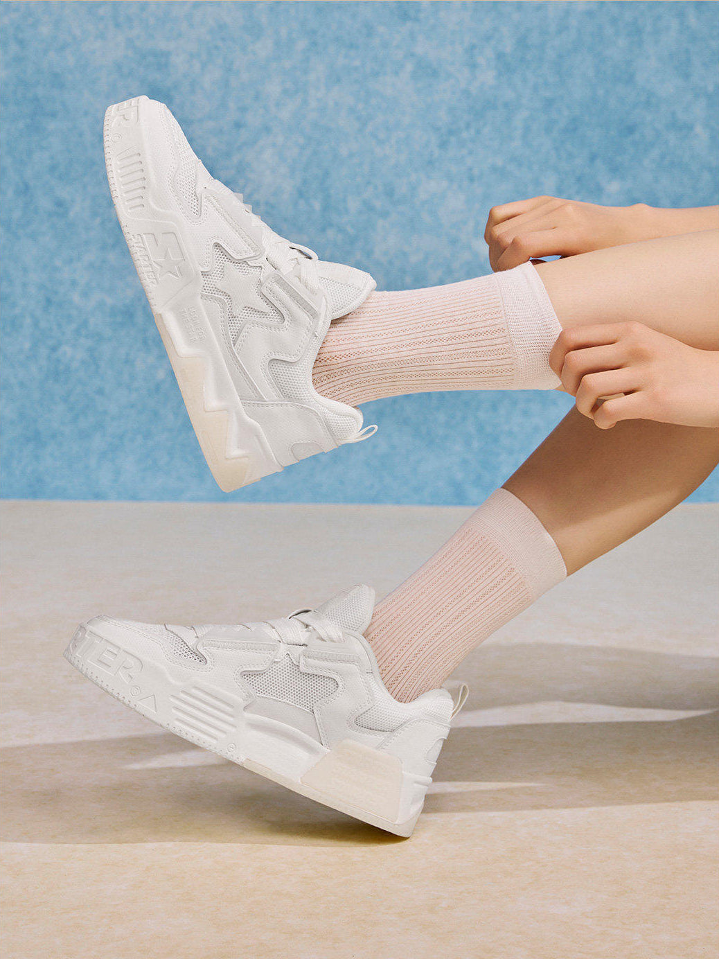 White STARTER VOL 90S mesh platform sneakers worn with ribbed socks, side view