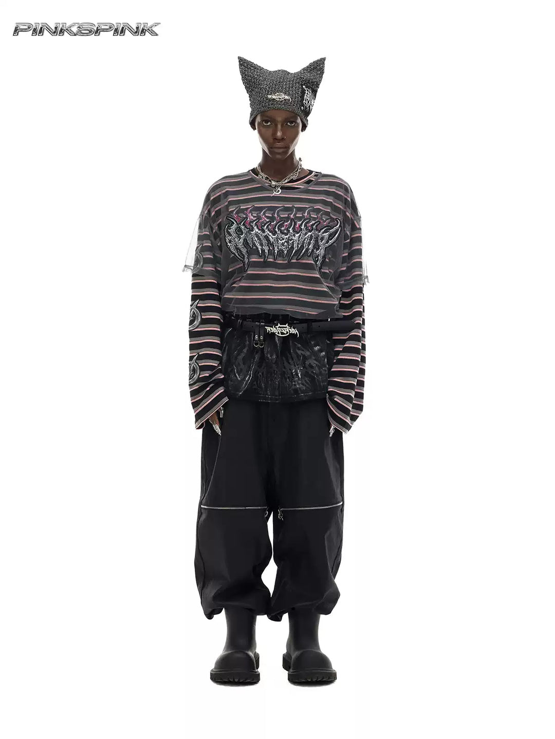 PINKSPINK ELECTRIC MOON coated zip-knee wide-leg pants in black — front full-length modeled view styled with a striped tee