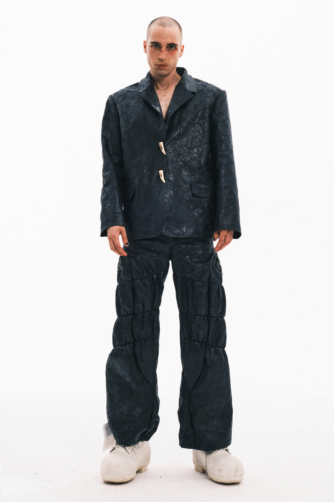 EMBRYO HORN CODE textured PU leather blazer — garment-only construction view