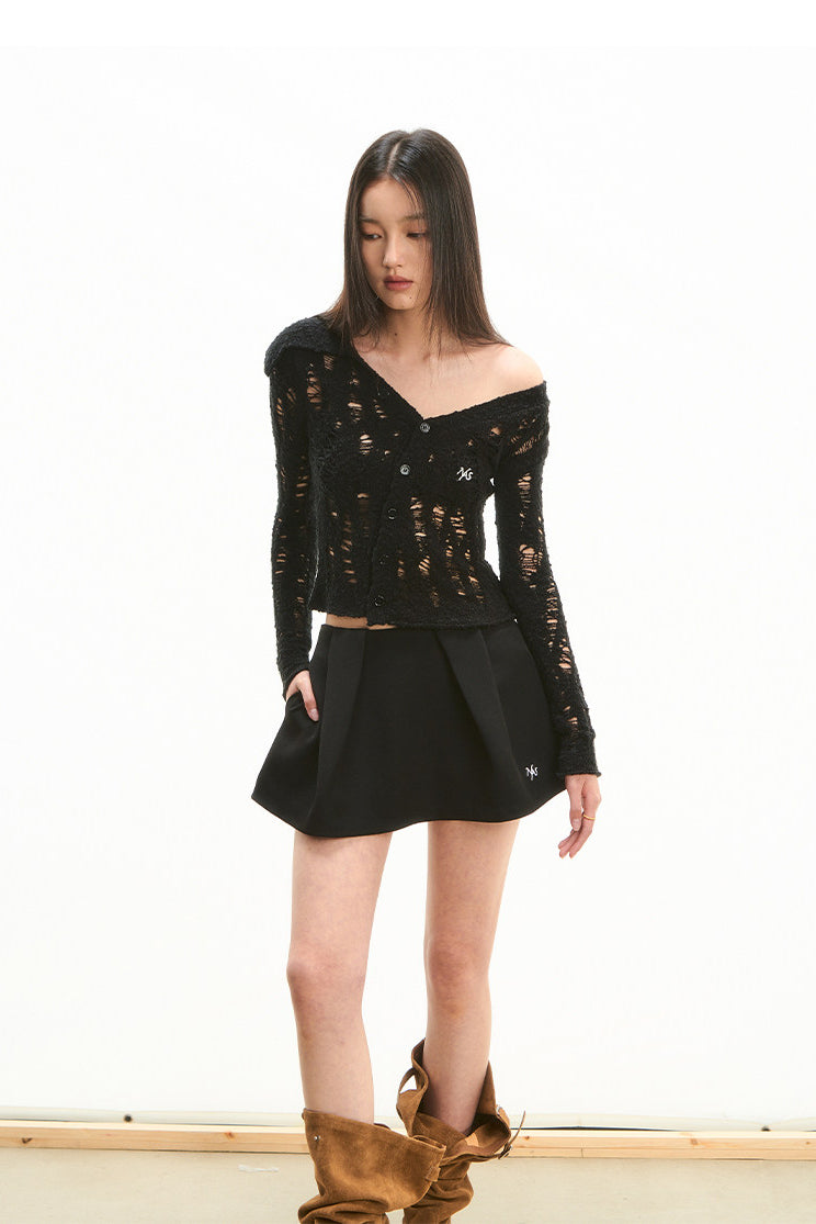 NAWS NOMAD asymmetric cutout knit cardigan — close-up view of the material and finishing