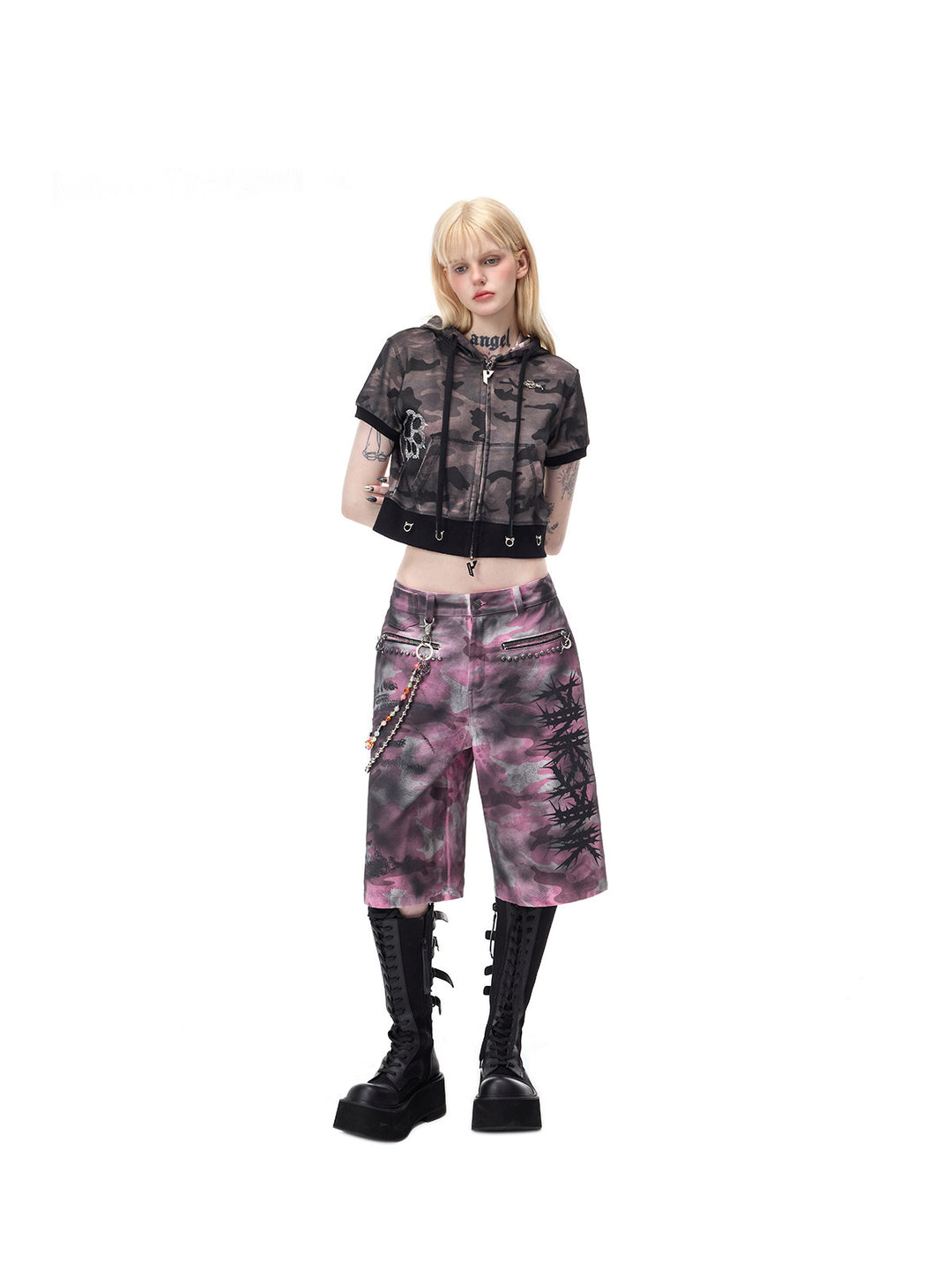 PINKSPINK ELECTRIC MOON coated camouflage denim shorts in pink-gray camouflage — angled full-length view with relaxed wide legs