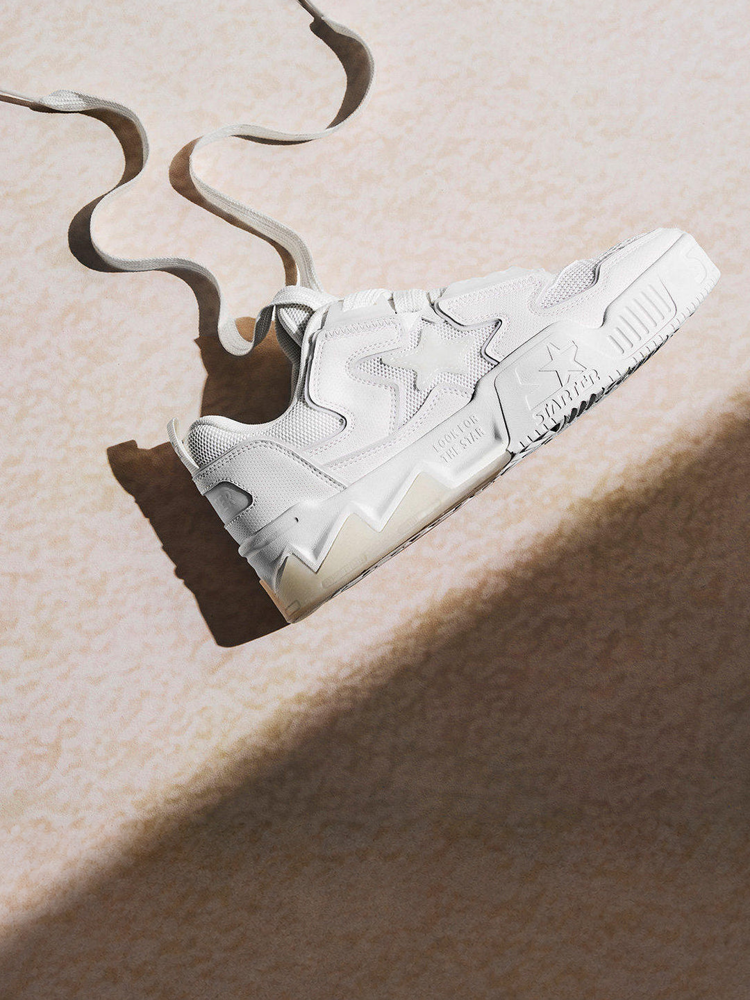 White STARTER VOL 90S mesh platform sneaker with loose wide laces in sunlight, side detail