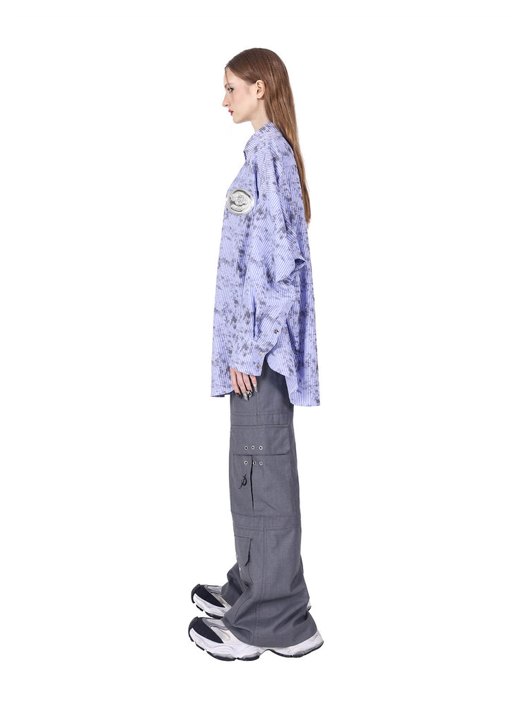 PINKSPINK ELECTRIC MOON ring-detail cargo flare trousers in gray — side view styled with a separate striped shirt and sneakers