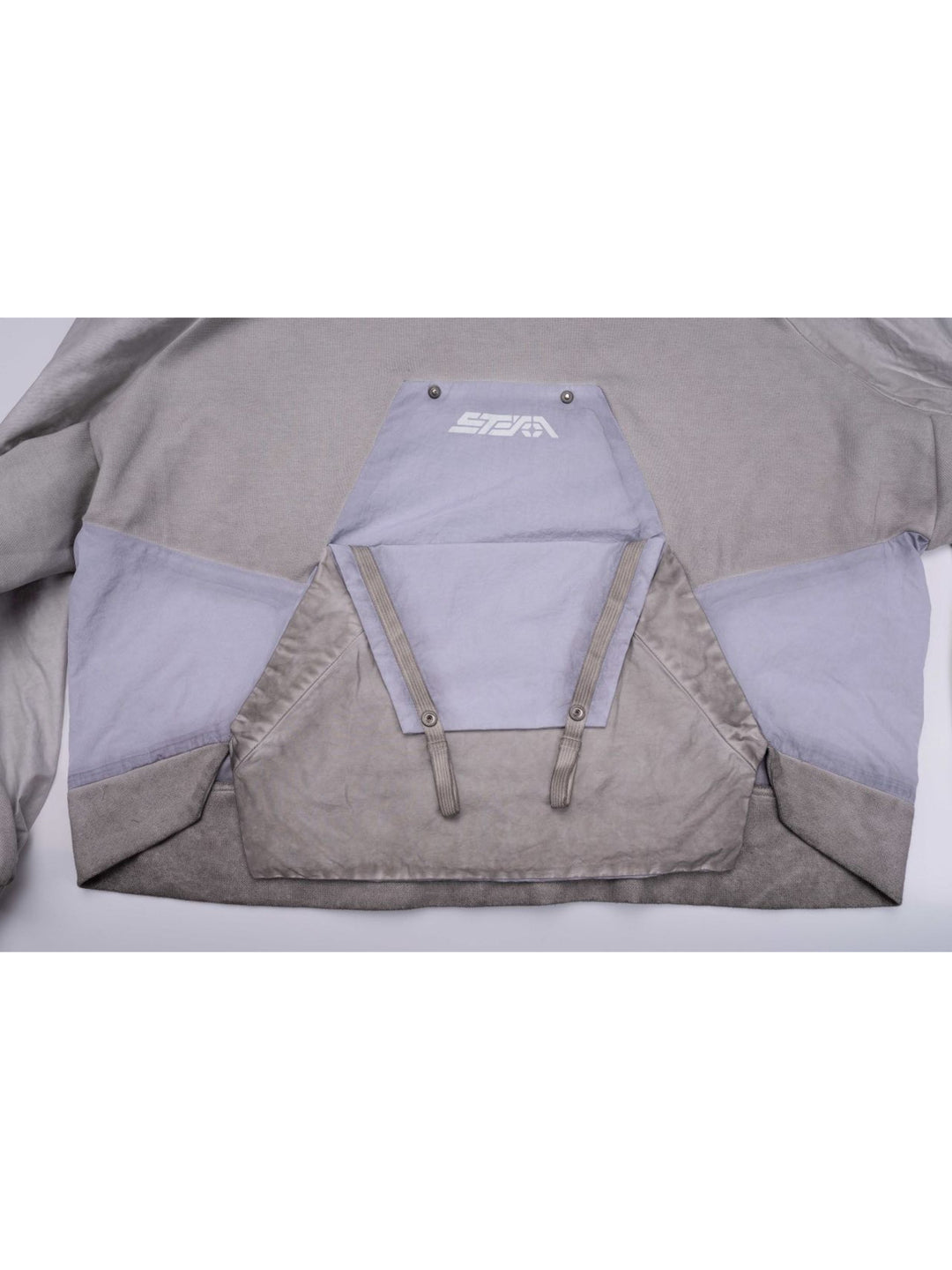 PIONEER eris white detachable-pocket utility hoodie — close-up of the opened chest pocket with reflective brand logo and hanging straps