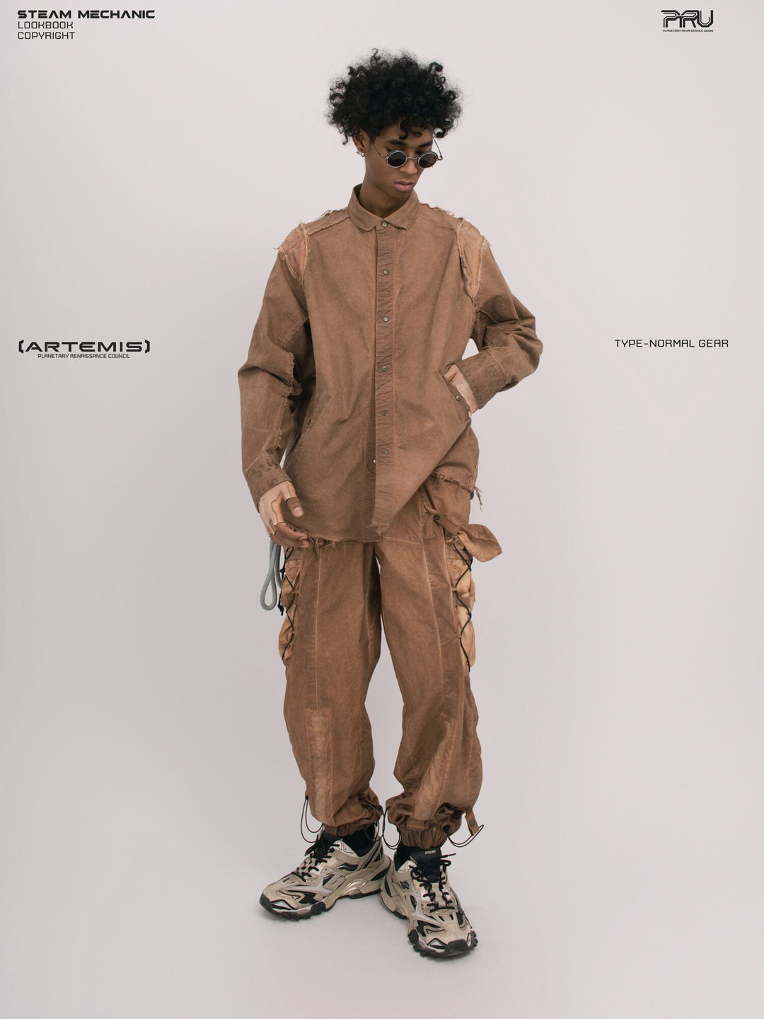 CHAOS ERA raw-edge technical shirt in soft dawn orange — full-length front modeled view with one hand at the hip